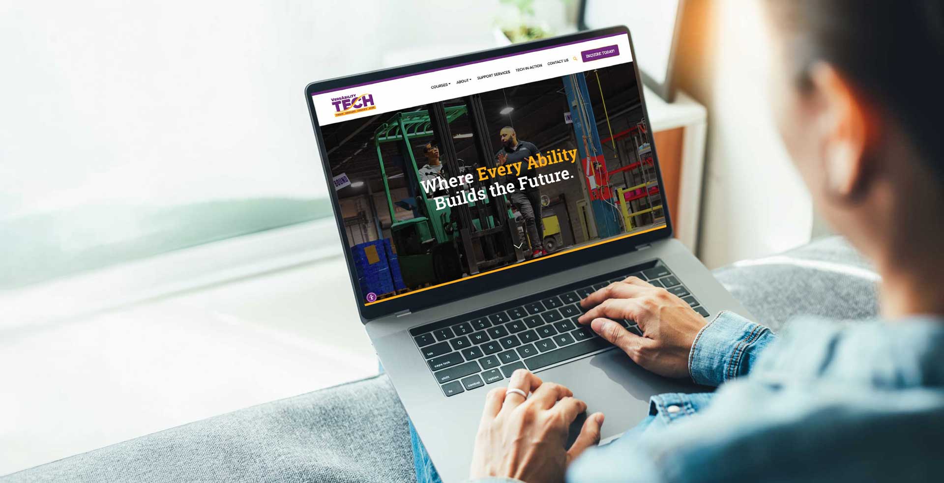 User of the VersAbility TECH website on a laptop